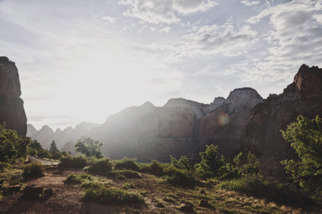 A photo of Zion National Park at sunset, overlooking red cliffs.