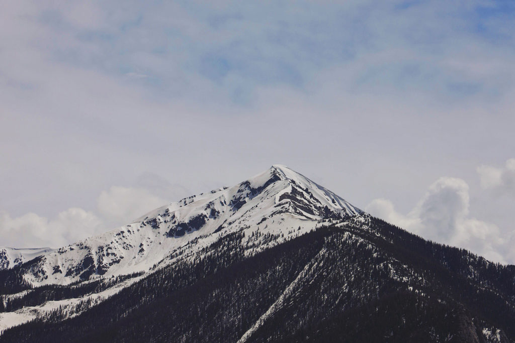 A photo of a snow capped mountain.
